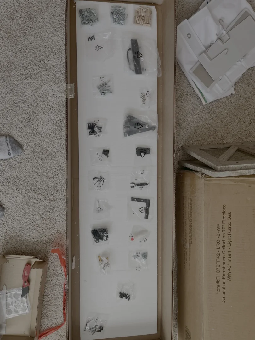 Organized furniture hardware and parts laid out for assembly in Spring Hill, TN